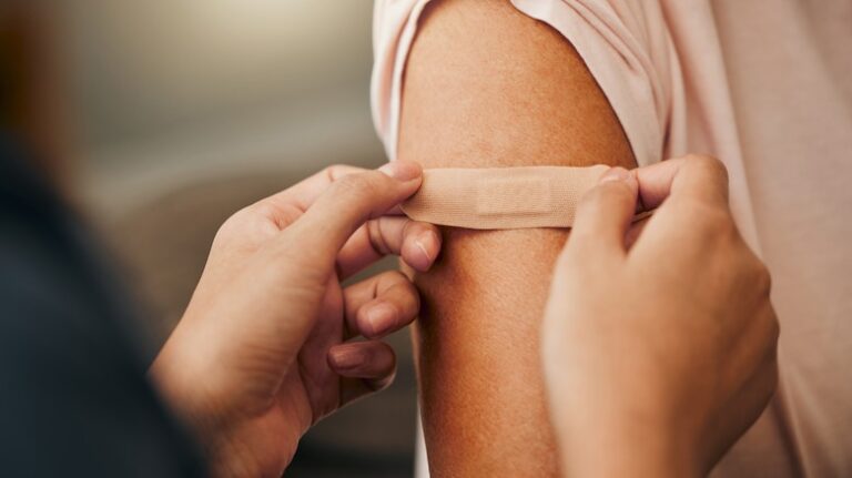 Covid,,Vaccine,And,Plaster,With,A,Doctor,And,Patient,Consulting